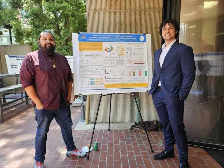 Jesus Mauricio and Martin Ibarra presenting a poster