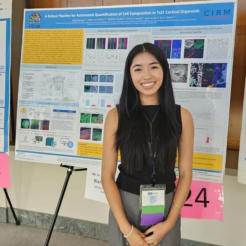 Student presenting a poster