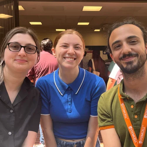 Alexis Weber, Emily Friedman and Shahab Younesi at a scientific symposium